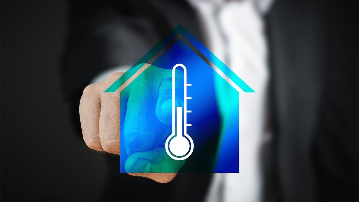 Ikona przedstawiająca proces regulacji temperatury w budynku mieszkalnym